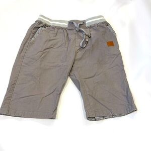 Grey shorts with striped accents